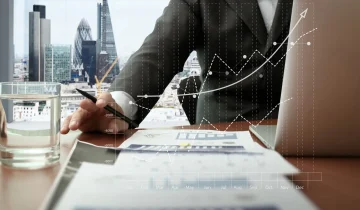 business documents on office table with smart phone and digital business documents on office table with smart phone and digital